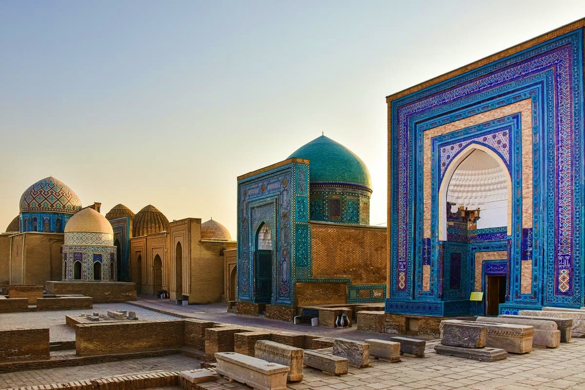Historic Islamic mausoleums and mosques with turquoise domes and ornate tilework in Samarkand, Uzbekistan