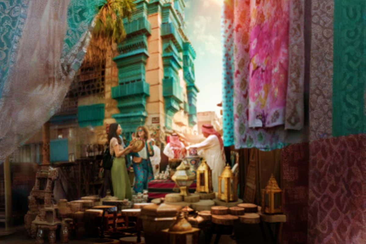 Narrow alley in historic Jeddah with traditional architecture, colorful fabrics hanging between buildings, and local people i
