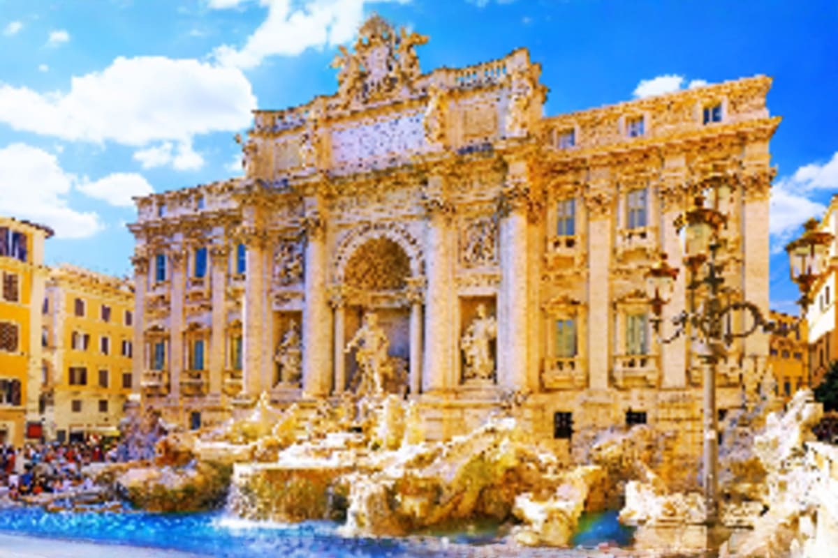 Trevi Fountain in Rome, Italy, with ornate Baroque architecture, sculptural details, and blue water surrounded by historic bu