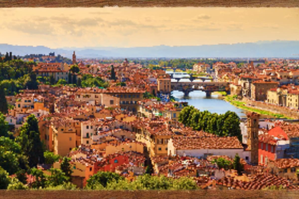 Glimpse of Europe Aerial view of Florence, Italy showing terracotta roofs, the Arno River with bridges, and surrounding Renaissance architectur