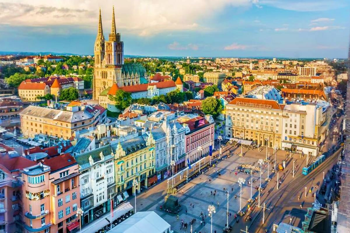 Aerial view of Zagreb's Ban Jelačić Square with Cathedral of the Assumption and colorful historic buildings in central Europe