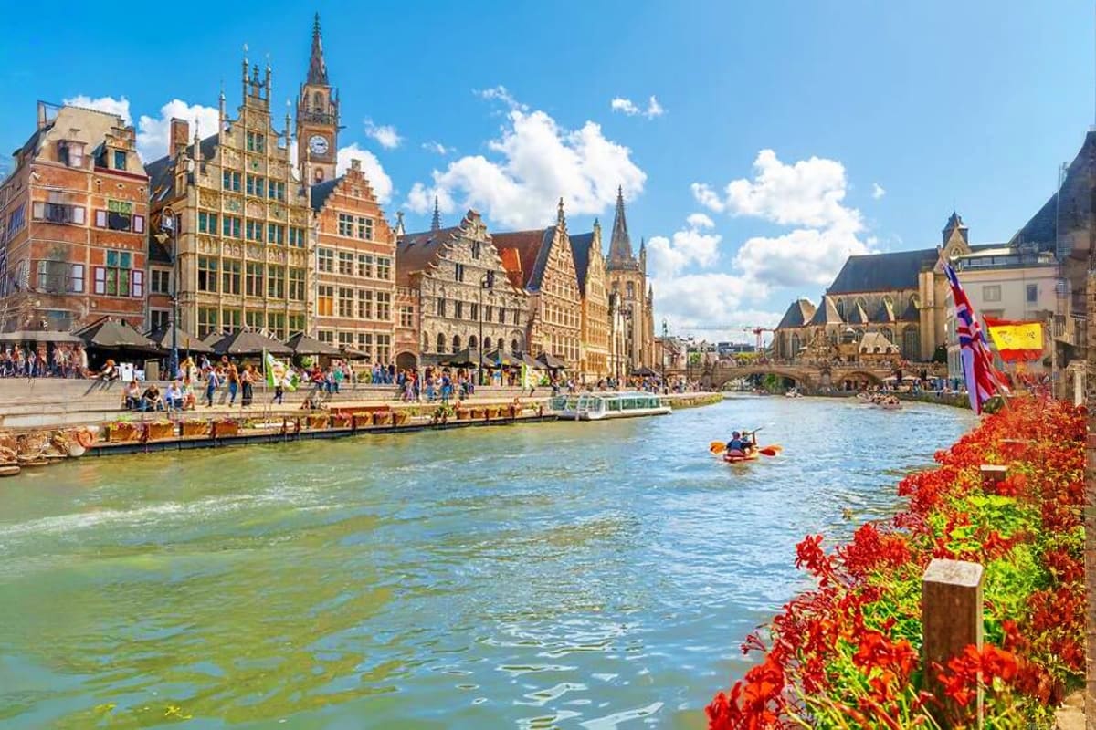 Medieval architecture and river along Ghent waterfront with historic guild houses, Belgium