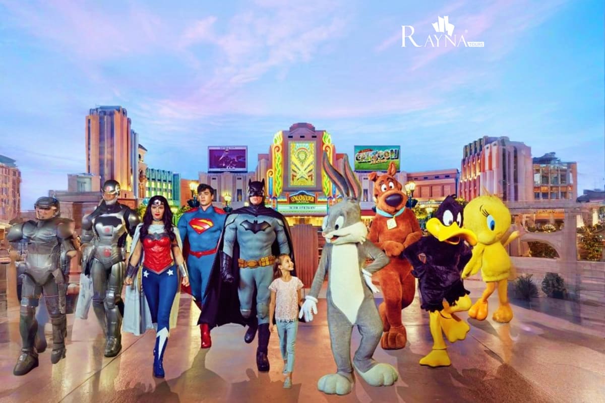Superhero characters and cartoon mascots walking through Abu Dhabi cityscape with illuminated buildings and entertainment ven