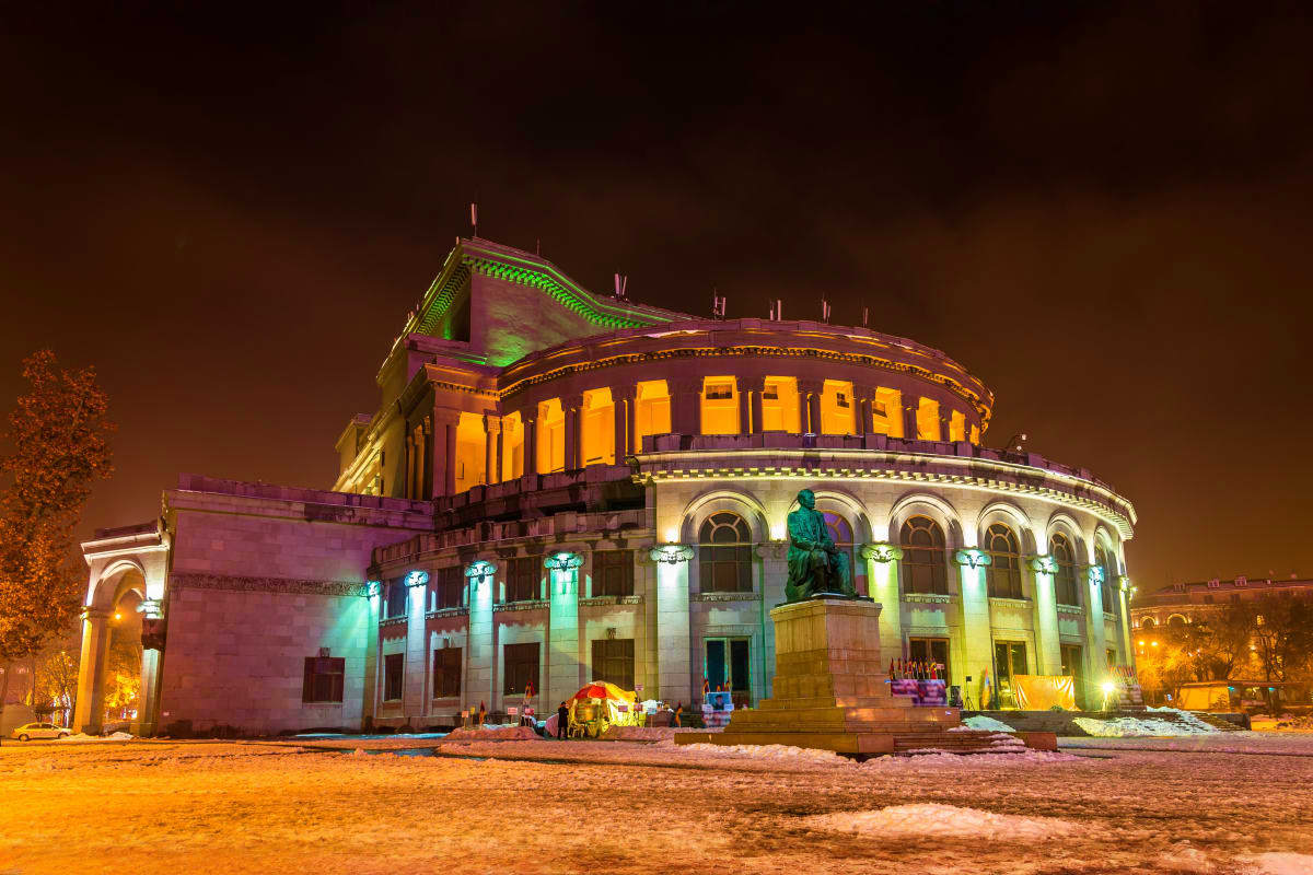 St. Gregory Cathedral illuminated at night with green and gold lighting in Yerevan, Armenia