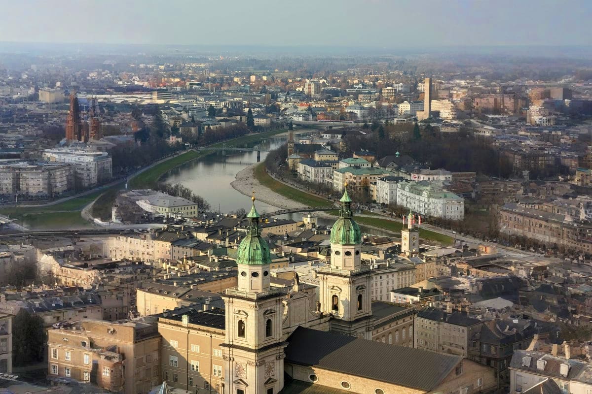Aerial view of Passau, Germany showing the Dom St. Stephan cathedral with green copper domes overlooking the Inn River and ci