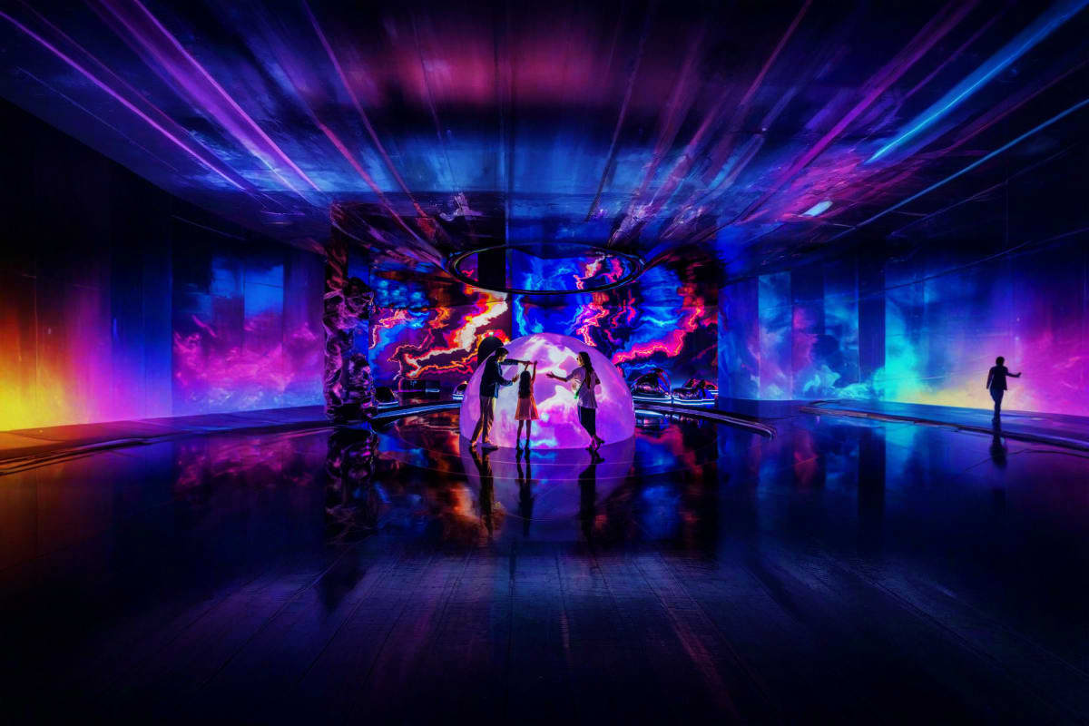 Dubai Little Explorers Kids Holiday Package Immersive digital art installation with neon purple and blue lighting, silhouettes of people exploring interactive display in