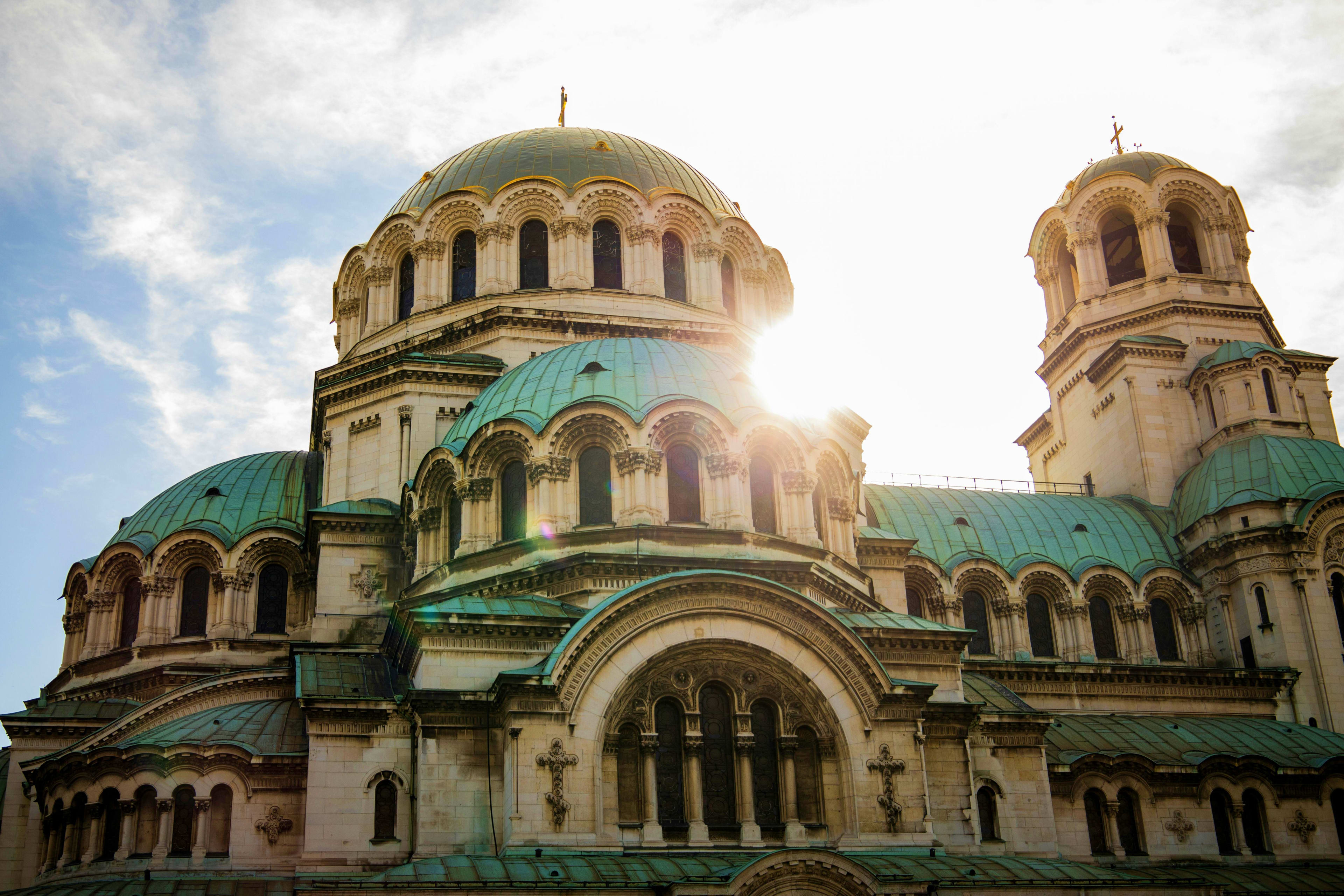 Bulgaria Alexander Nevsky Cathedral in Sofia, Bulgaria with golden domes and turquoise copper roofs against cloudy sky