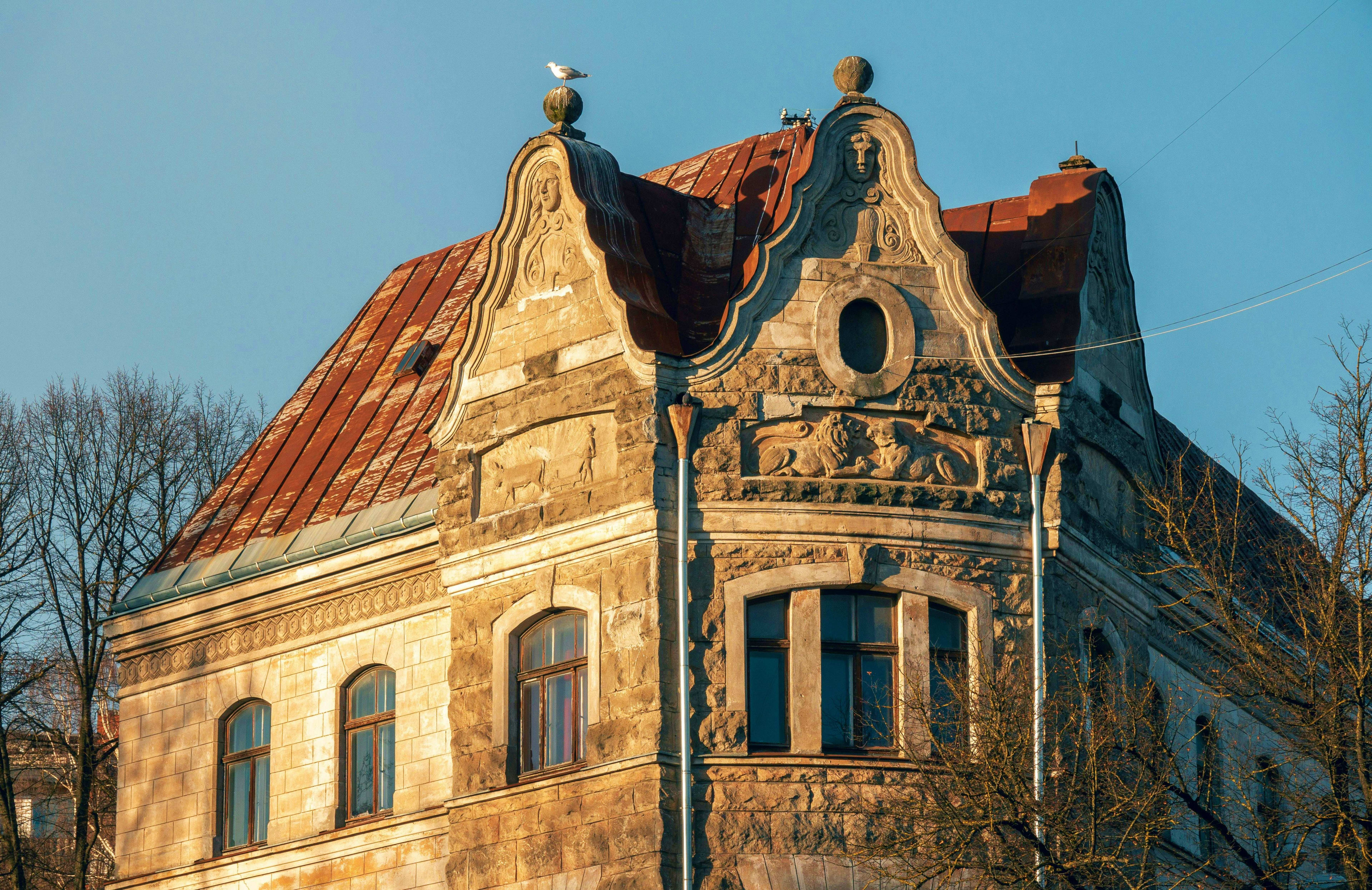 Latvia Historic Art Nouveau building with ornate stone facade and copper roof in Riga, Latvia, featuring decorative gables and a sea