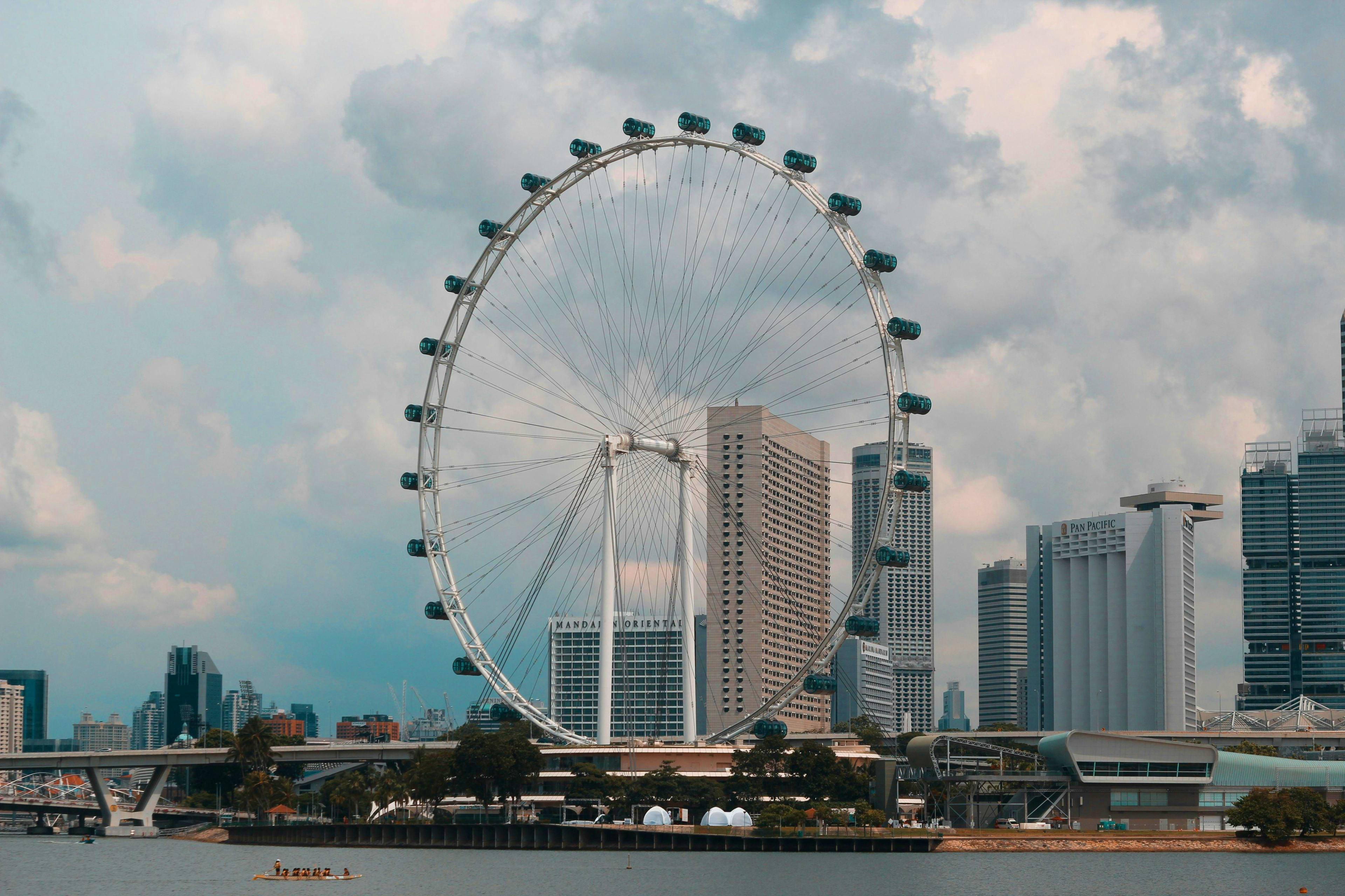 Singapore London Eye observation wheel with Singapore skyline and Marina Bay waterfront