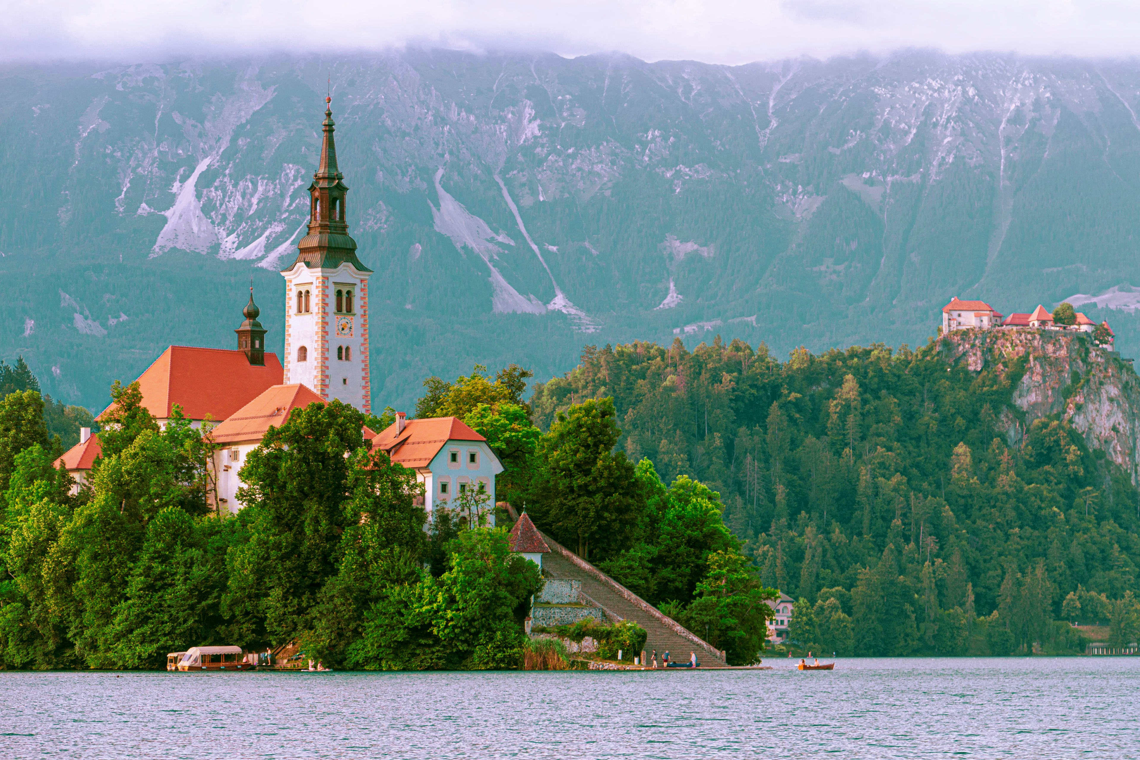 Slovenia Church of the Assumption on an island in Lake Bled, Slovenia, surrounded by forested mountains and cliffs