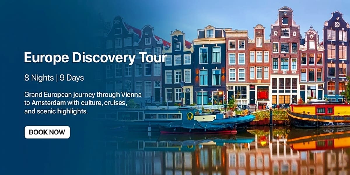 Colorful historic canal houses and boats reflected in Amsterdam waterway at sunrise