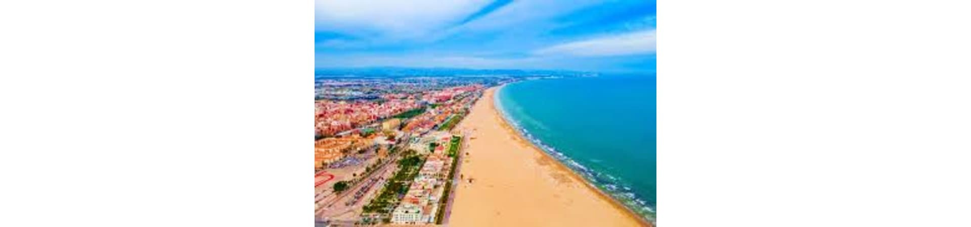 Aerial view of Malvarrosa Beach in Valencia, Spain with turquoise Mediterranean Sea and sandy shoreline