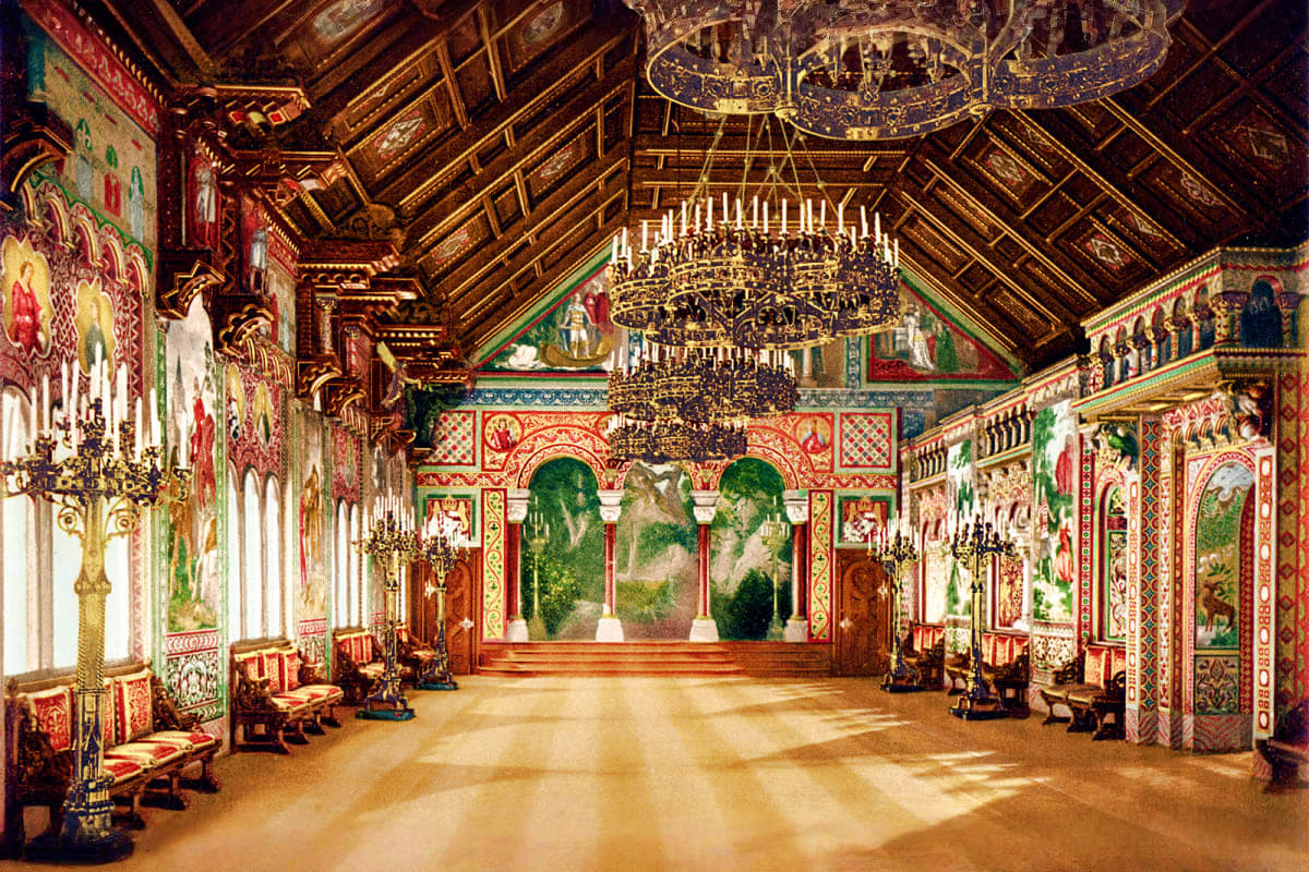 Munich to Neuschwanstein Castle Full Day Tour Ornate Bavarian palace interior with gilded wooden ceiling, elaborate red and gold wall paintings, crystal chandeliers, and d