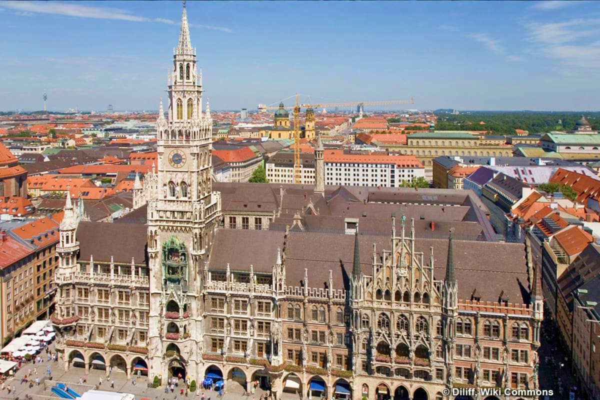 Aerial view of Munich's Neues Rathaus (New Town Hall) with Gothic Revival architecture and spire, overlooking the city skylin