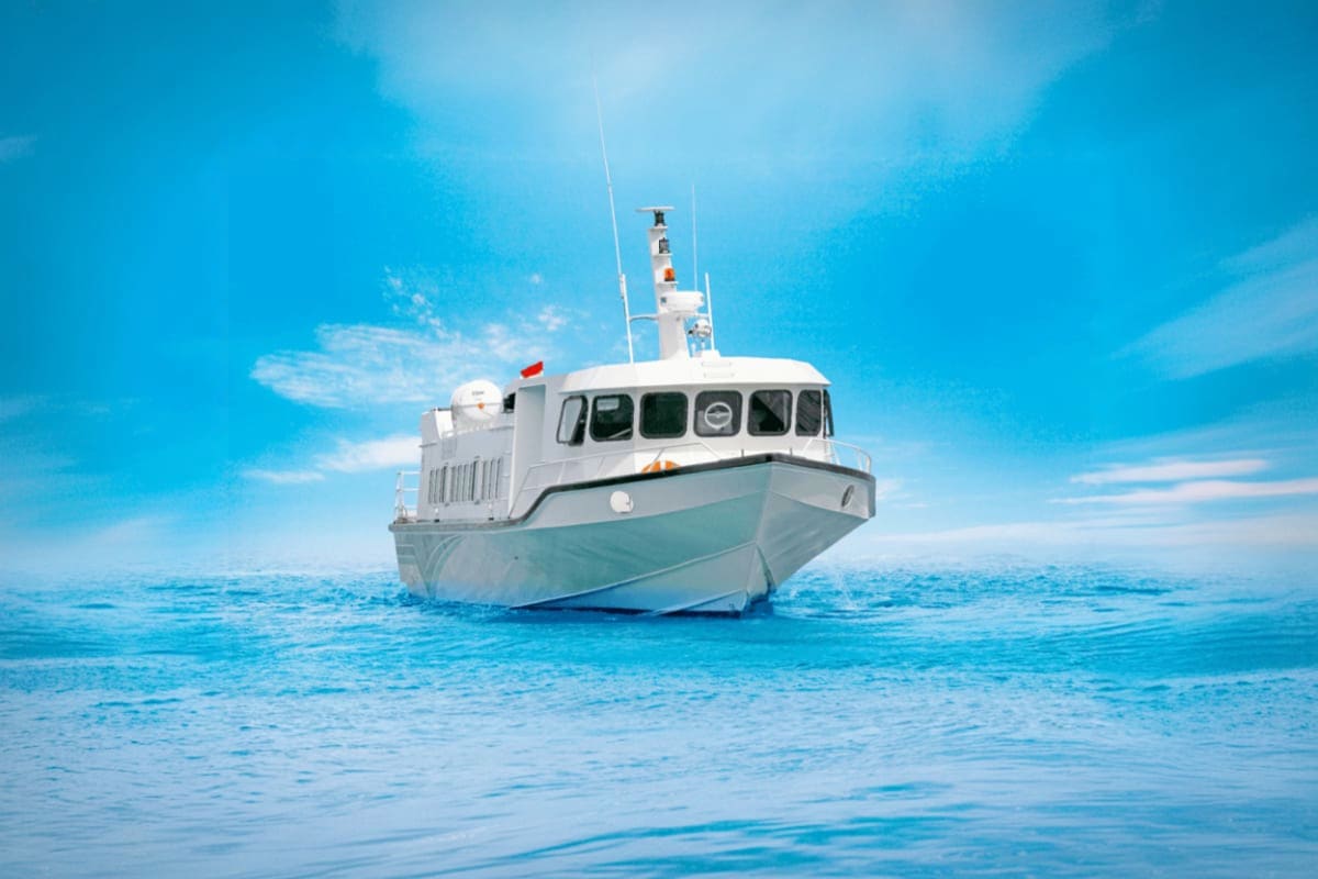 Fast Boat Ticket between Bali Lombok and Nusa with Gili Islands White and teal fast boat anchored in clear turquoise water under blue sky, representing inter-island ferry transport