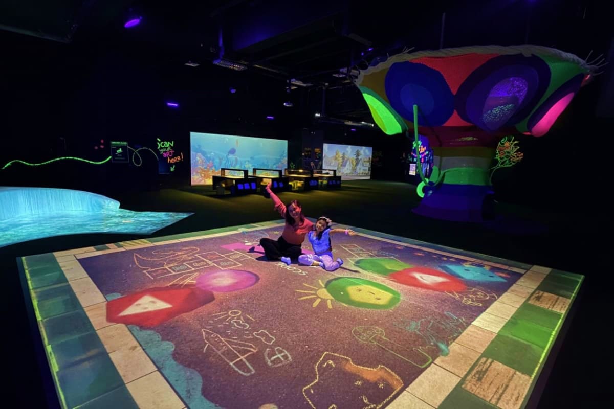 PlayLab Robinsons Galleria in Cebu Interactive digital art installation at PlayLab Robinsons Galleria with two visitors on illuminated floor displaying colorful