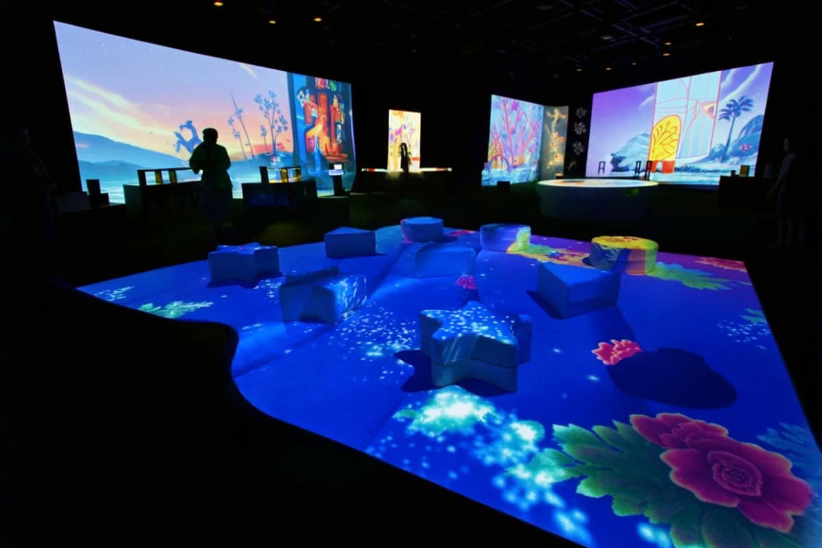 PlayLab Robinsons Galleria in Cebu Interactive digital art installation with blue illuminated floor featuring coral and fish projections, soft seating cubes, an
