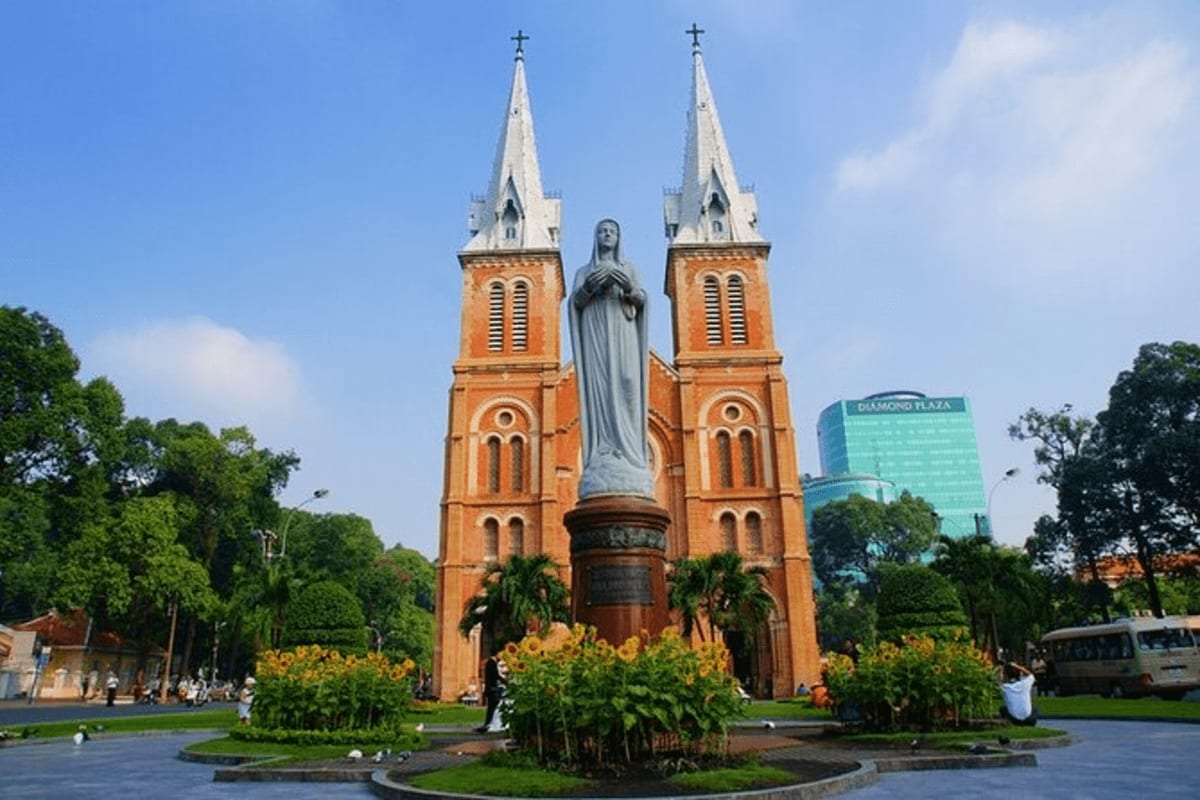 Saigon Notre-Dame Cathedral with twin spires and Mary statue in Ho Chi Minh City