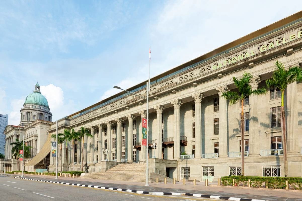 National Gallery Singapore building exterior with neoclassical architecture, grand columns, dome, and wide stone steps facing