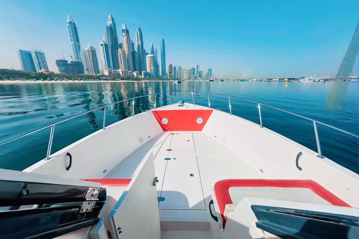Silver Craft X13 View from bow of Silver Craft X13 yacht with Dubai Marina skyline and calm turquoise waters in background
