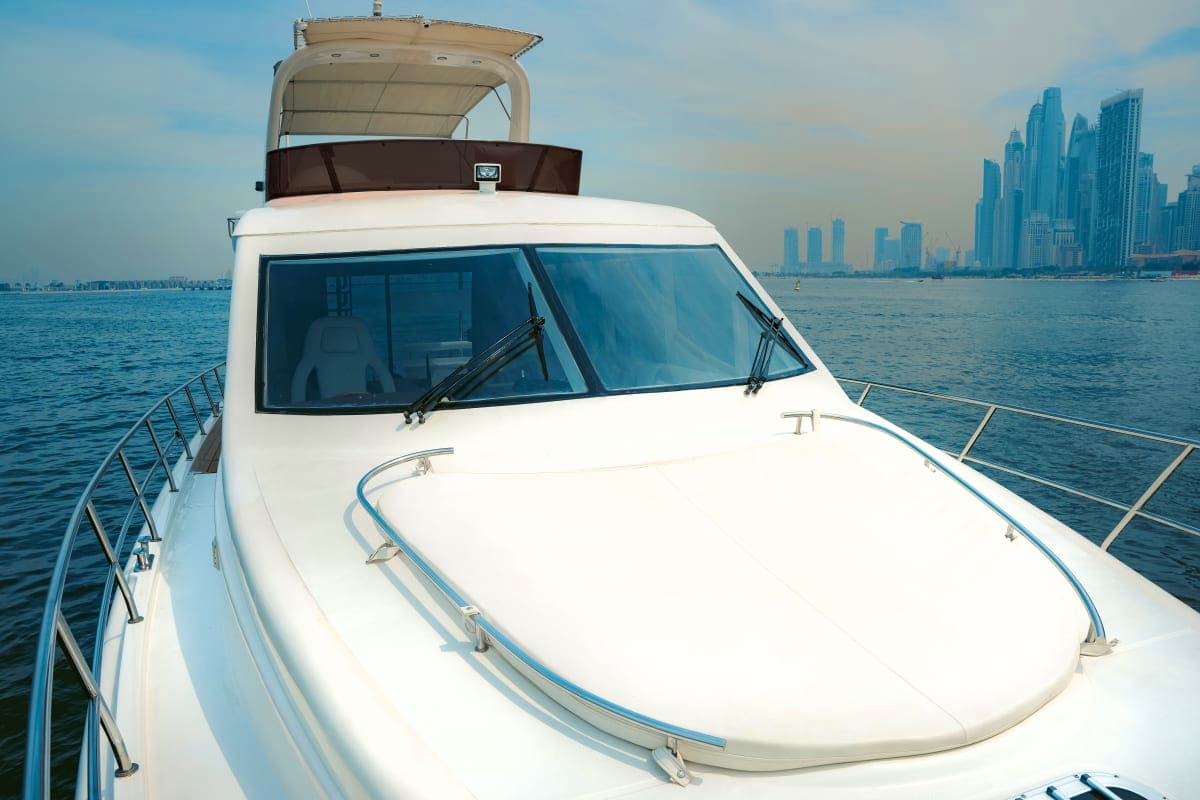 Duretti X1 White luxury yacht Duretti X1 on calm sea with modern city skyline in background