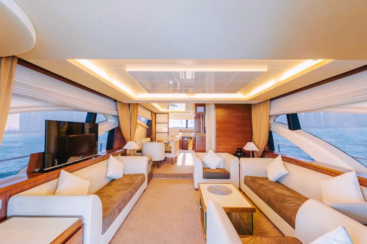 75 Ft Supreme Luxury Yacht Luxury yacht interior with cream and wood furnishings, multiple seating areas, LED ceiling lights, ocean views through window