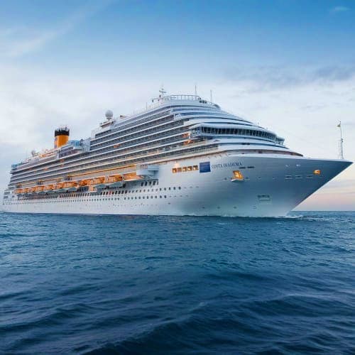Large modern cruise ship sailing on blue ocean waters under clear sky