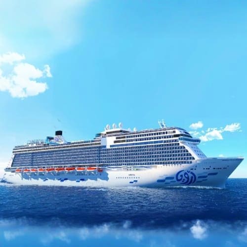 Large modern cruise ship sailing on blue ocean waters under clear sky with white clouds
