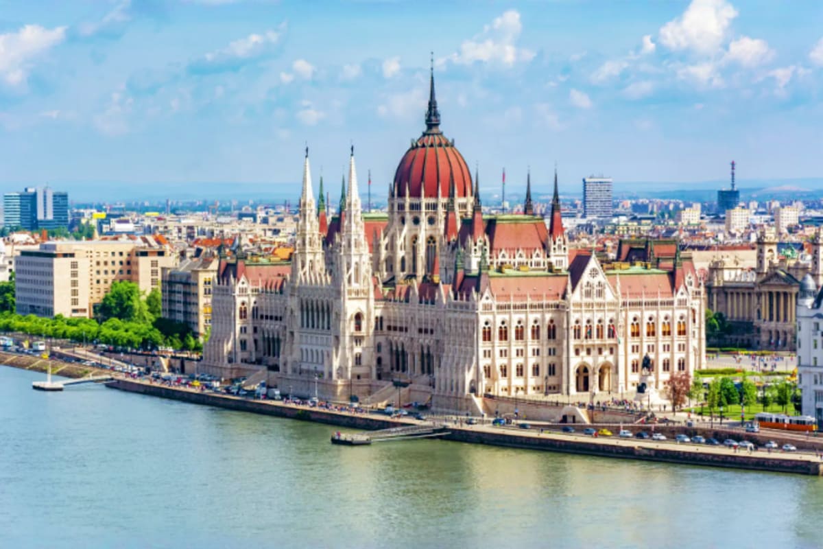 Hungarian Parliament Building on the Danube River in Budapest with neo-Gothic architecture and red dome roof