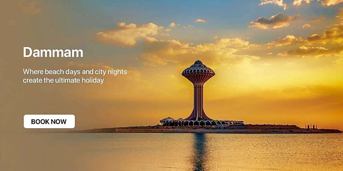 Dammam water tower at sunset with golden sky and calm sea waters reflecting the landmark's silhouette