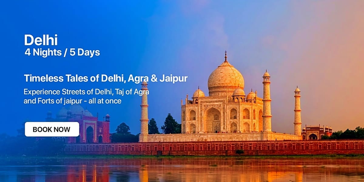 Taj Mahal at sunset reflected in river water with golden dome and minarets illuminated against blue sky