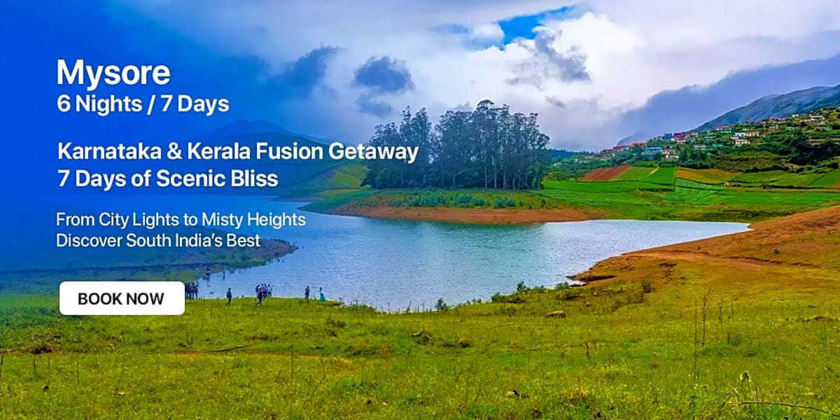 Scenic lake landscape in Mysore surrounded by green hills, forests, and misty mountains with blue sky and clouds