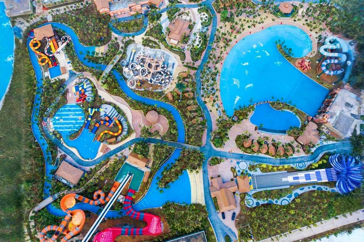 Sun World Ha Nam Aerial view of Sun World Ha Nam water park with blue pools, water slides, lazy river, and lush green landscaping