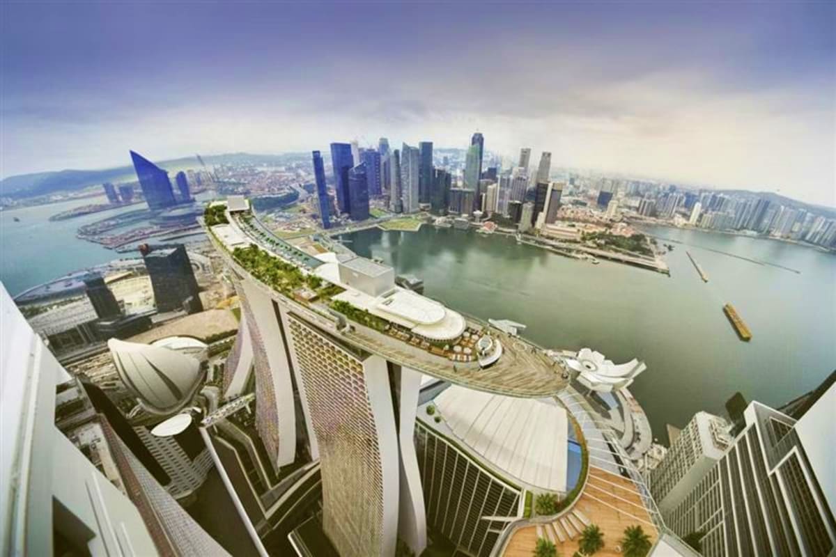 Exclusive Singapore and sentosa tour Aerial view of Singapore skyline with Marina Bay, downtown skyscrapers, and cruise ship docked at terminal