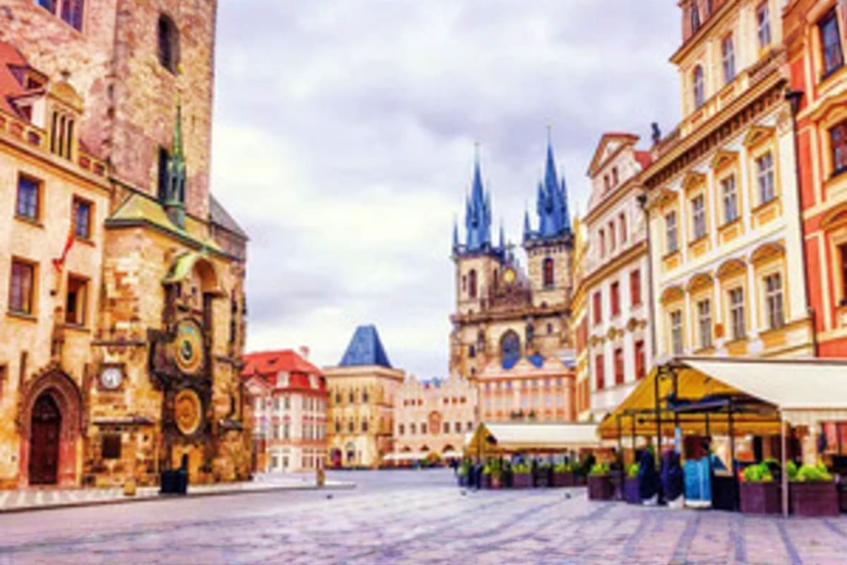 Old Town Square in Prague with Church of Our Lady before Tyn, historic buildings, and outdoor café seating