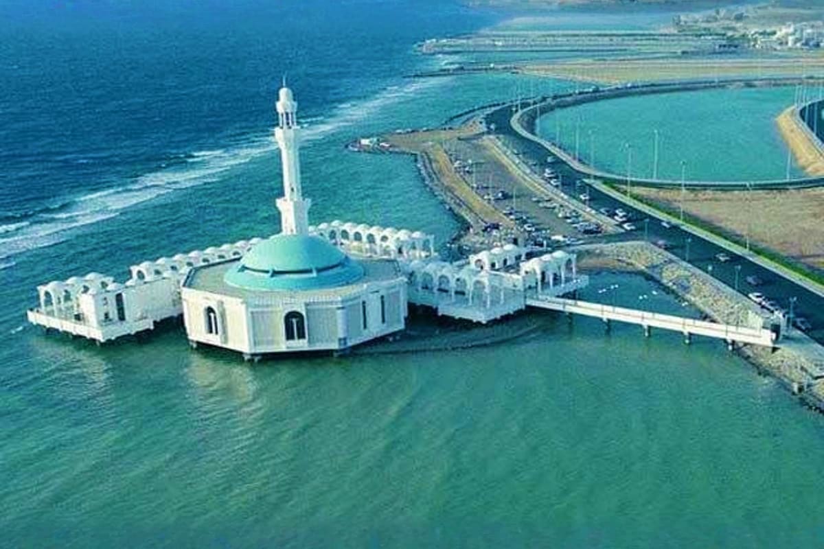 Aerial view of Al-Hakim Mosque with turquoise dome and minaret in shallow Red Sea waters near Alexandria coast