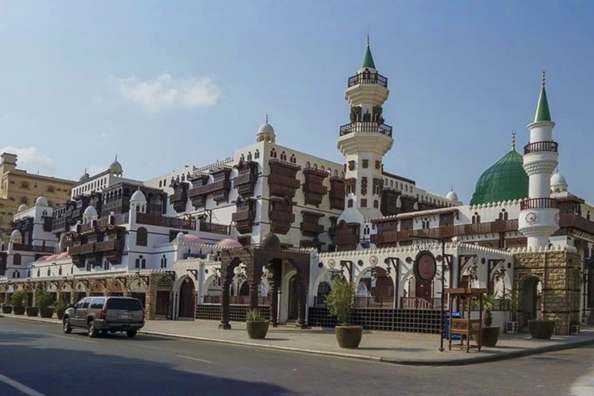 Al-Hakim Mosque with ornate Islamic architecture, minarets, and domed structures in Cairo's historic district