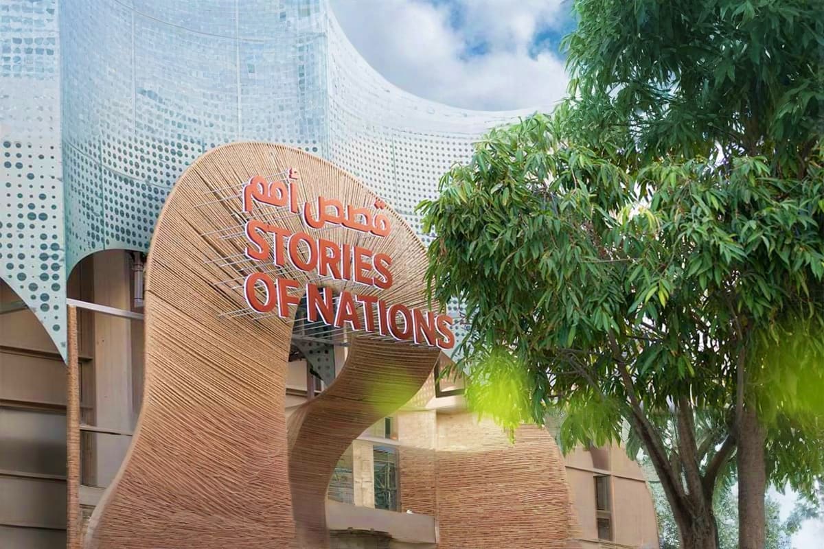 Illuminated Vision pavilion at Expo City Dubai at night with landscaped plaza, visitors, and modern architecture (4)