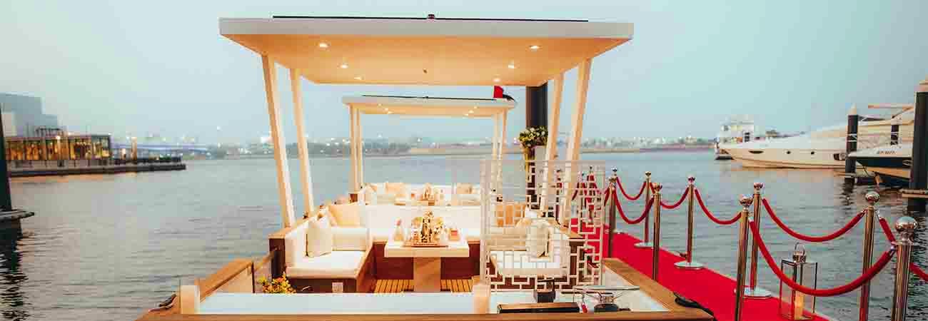 Red floating cafe on Thames River with Tower Bridge visible in the background across London skyline (2)