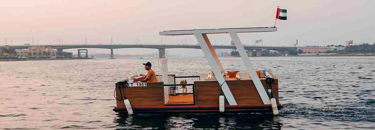 Red floating cafe on Thames River with Tower Bridge visible in the background across London skyline (3)