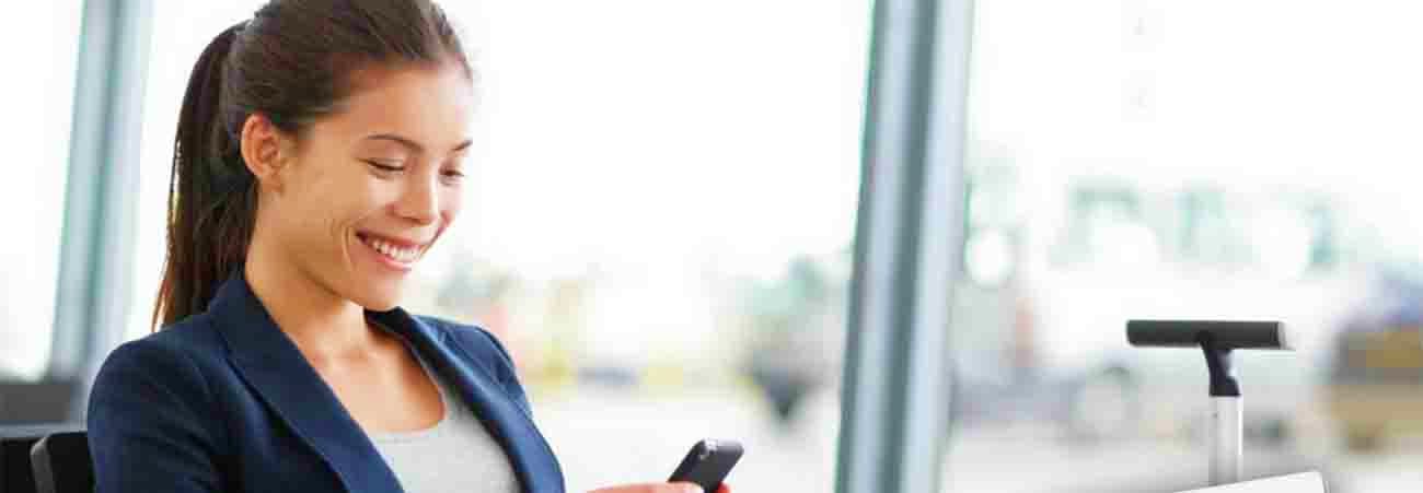Businessman in suit talking on phone with Etisalat SIM card displayed on desk (3)