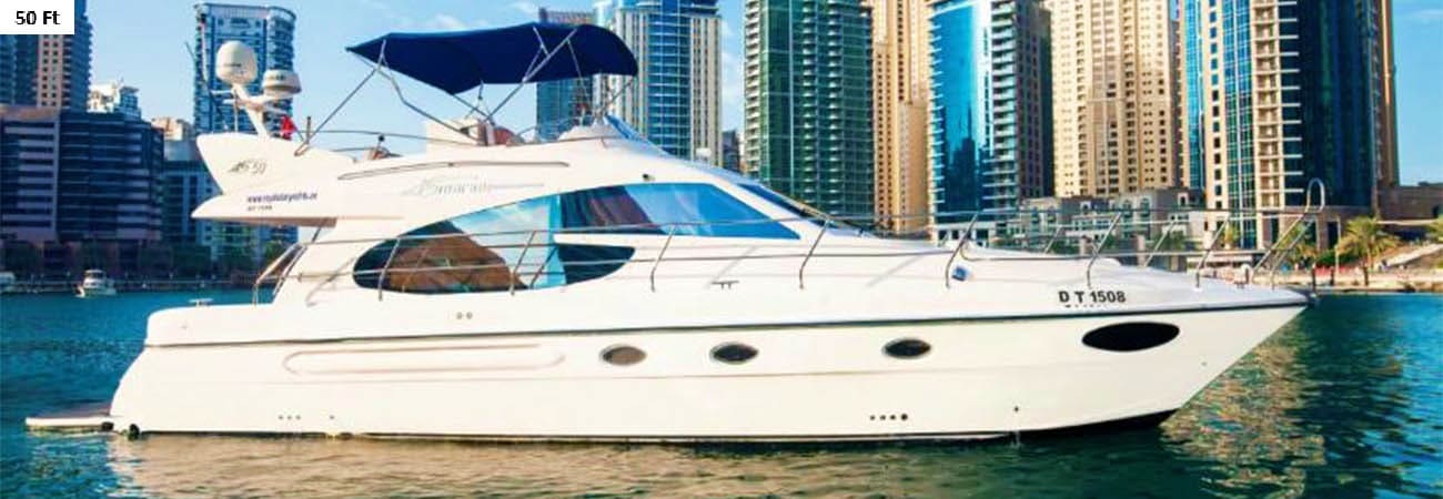 33-foot luxury yacht with passengers on turquoise ocean water, Dubai Marina skyscrapers in background (3)
