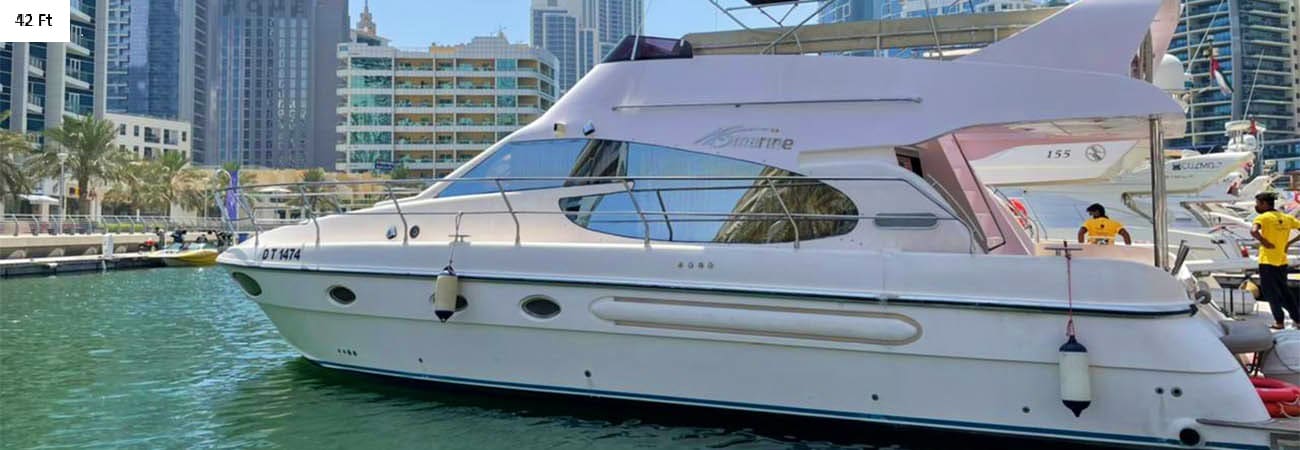 33-foot luxury yacht with passengers on turquoise ocean water, Dubai Marina skyscrapers in background (2)