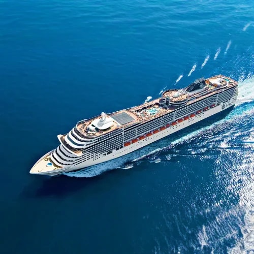 Aerial view of MSC Fantasia cruise ship traveling through deep blue Mediterranean waters