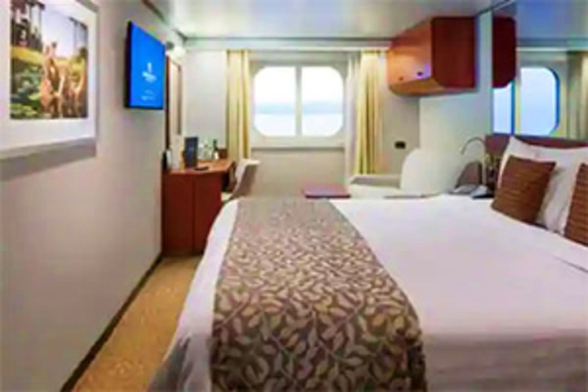 Eurodam cruise ship stateroom with two beds, ocean view balcony, flat-screen TV, and wooden furnishings