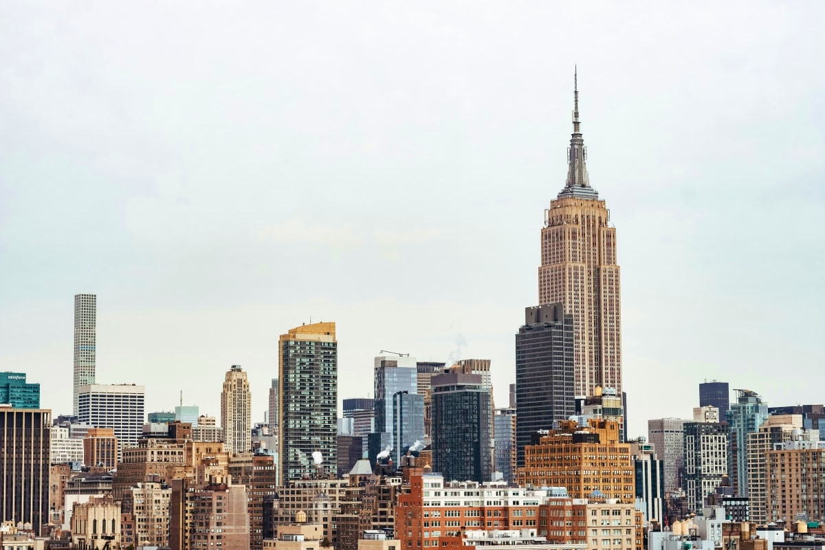 New York City skyline with Empire State Building prominently featured among mixed architectural styles