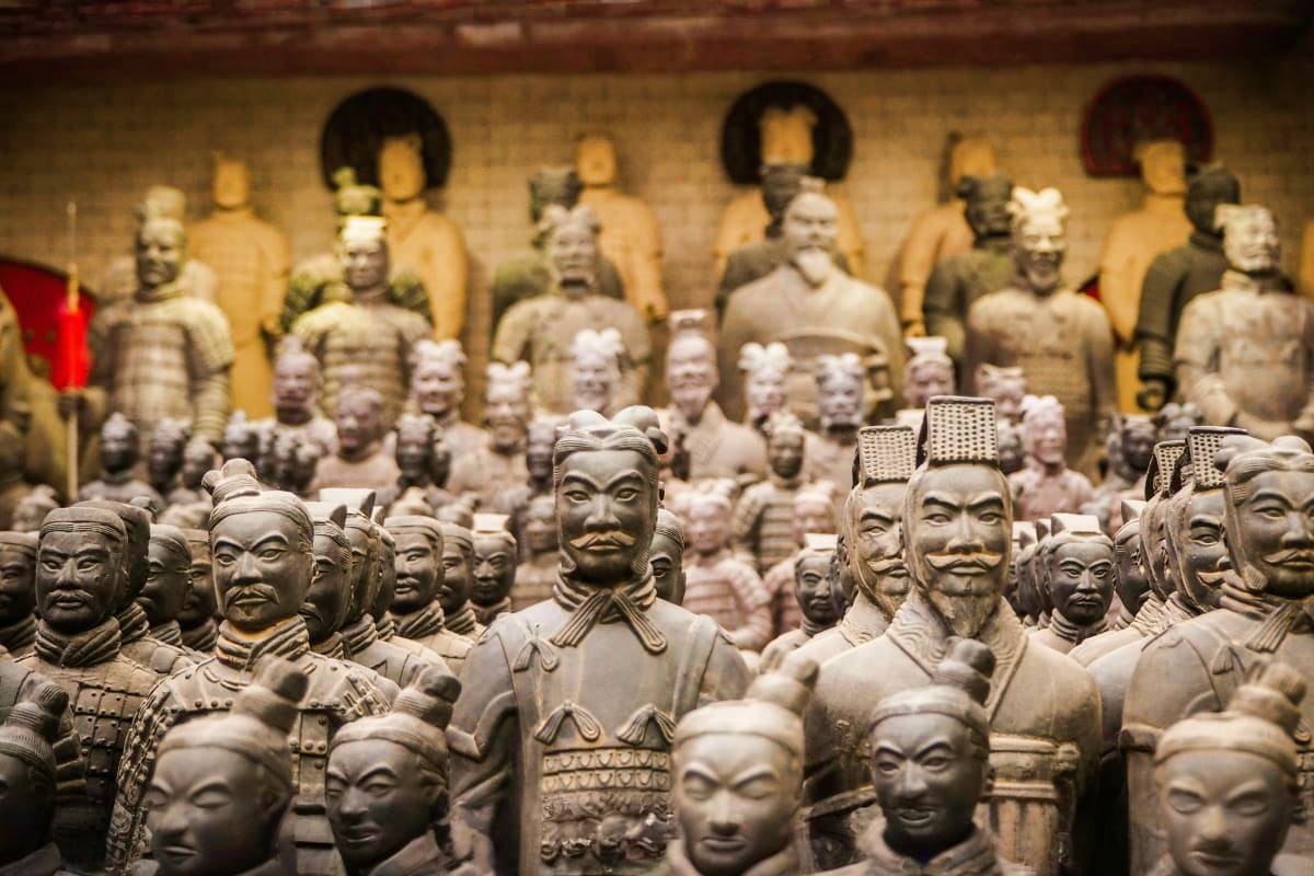 Terracotta warrior statues display at museum with hundreds of clay figures in formation representing ancient Chinese military