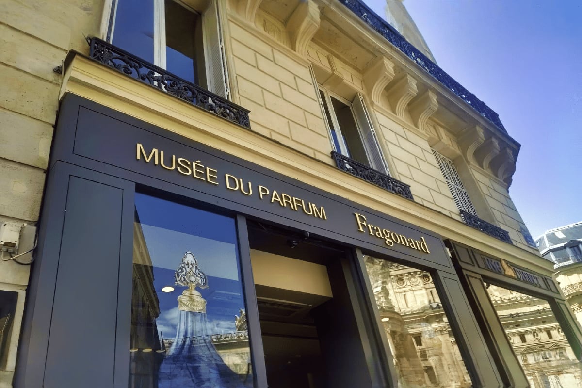 Swiss French Highlights with French Riviera Exterior of Musée du Parfum Fragonard perfume museum in Paris with cream-colored classical building facade and black storefro