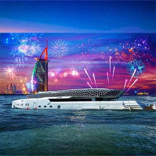 New Years Eve On Lotus Megayacht Lotus Megayacht docked in Dubai waters at sunset with Burj Al Arab hotel and colorful fireworks exploding in night sky