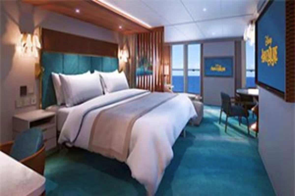 Magical Asia Cruise Escape Luxury cruise ship cabin with queen bed, teal headboard, ocean view windows, modern furnishings, and nautical décor